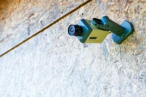 Fake Security Camera Placed On A Wooden Osb (oriented Strand Boa