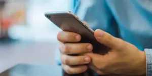 a hands holding an apple phone