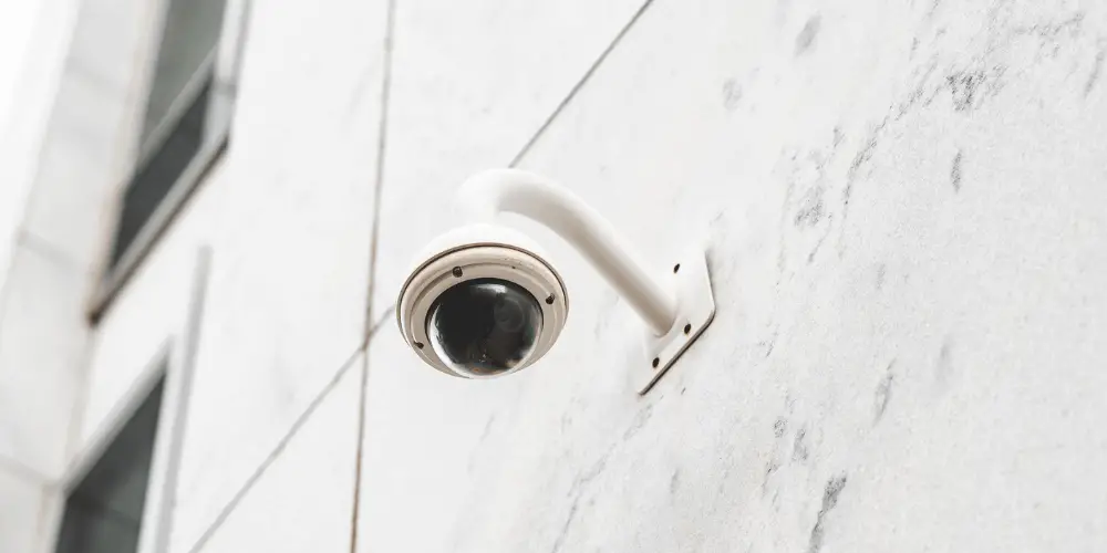 PTZ camera mounted on the wall outside a building