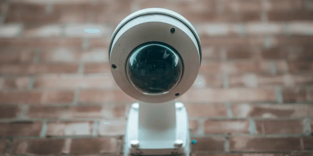 PTZ camera mounted in a wall facing the street