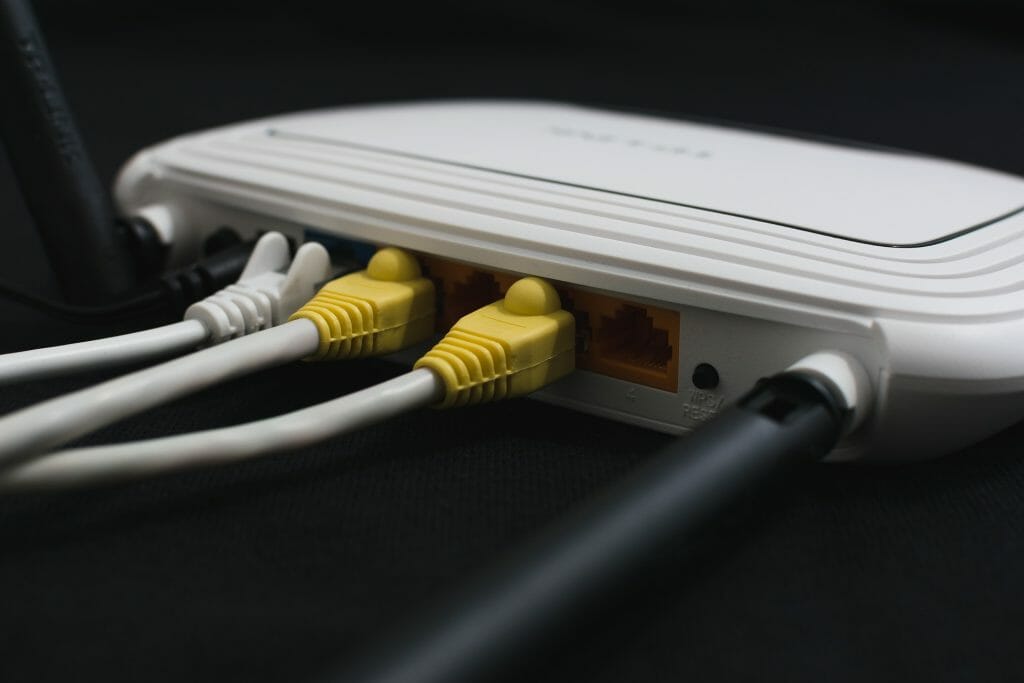 ethernet cables connected to a wifi box