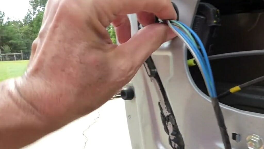 man disconnecting the cable wires