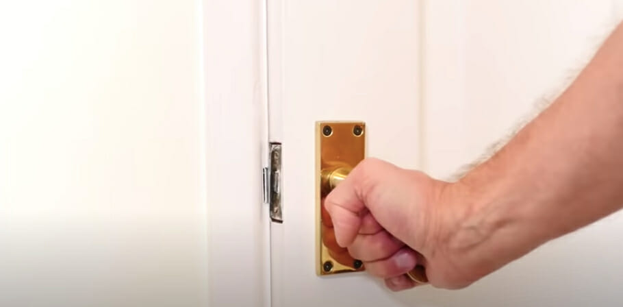 man holding a doorknob