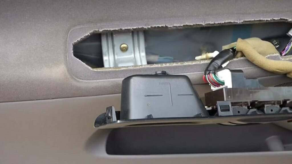 an opened car's power switch panel cover